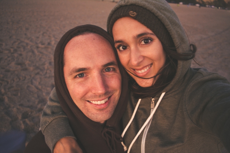 cute happy couple smiling selfie at beach